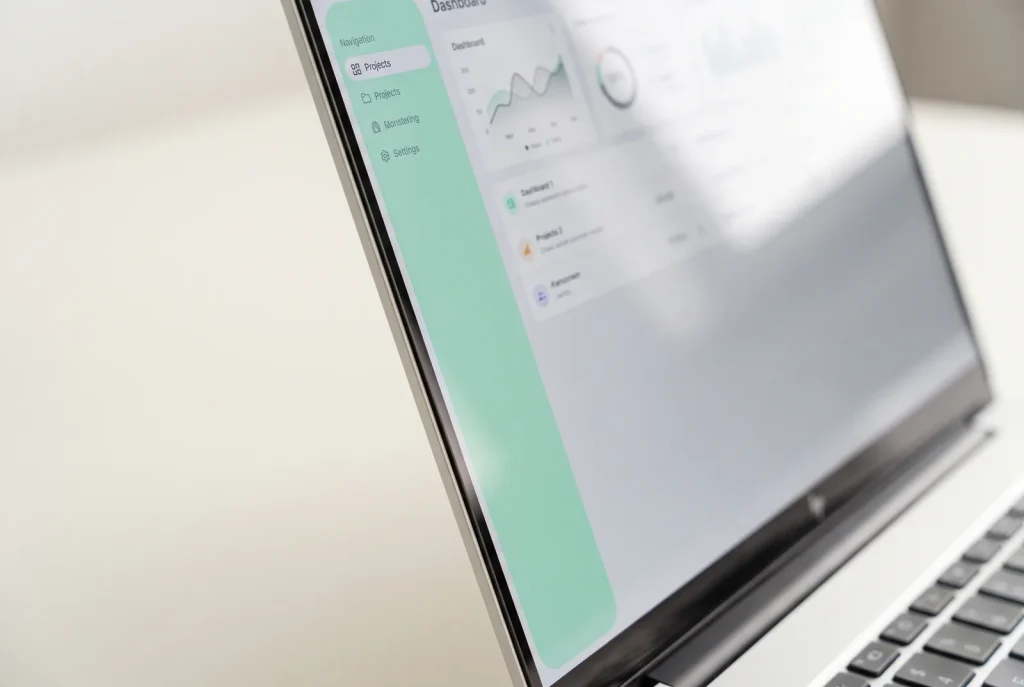 Custom web application interface edge detail on a laptop screen, Perth web design studio close-up